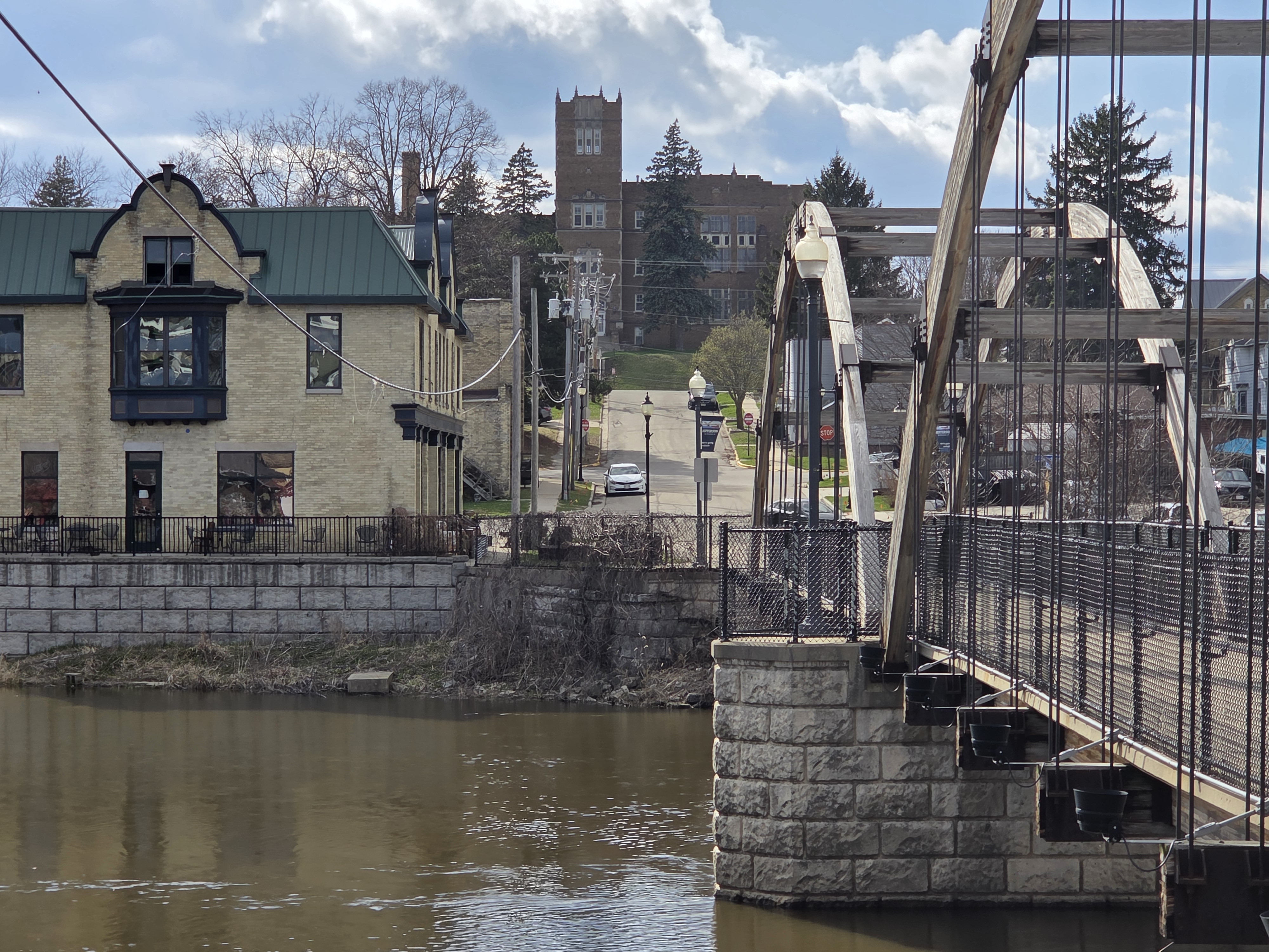 Downtown Jefferson, WI with historic bridge and buildings along the Rock River